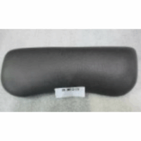 The Artesian Pillow Lounge Tropic Charcoal, a rectangular black padded headrest, is displayed on a light surface with a small white label beneath it.